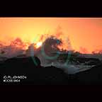 Sun setting behind wave in Pescadero California