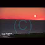 Moon setting along the California coast