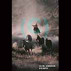 Cowboy rounding up wild horses